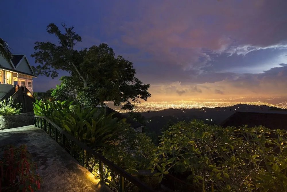 Nighttime mountain terrace view over city lights at Strawberry Hill.