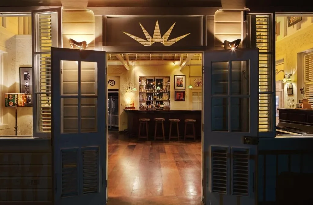 Open double doors reveal the warmly lit bar at Strawberry Hill.