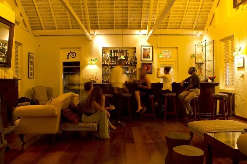 Guests seated in a warmly lit bar lounge at Strawberry Hill.