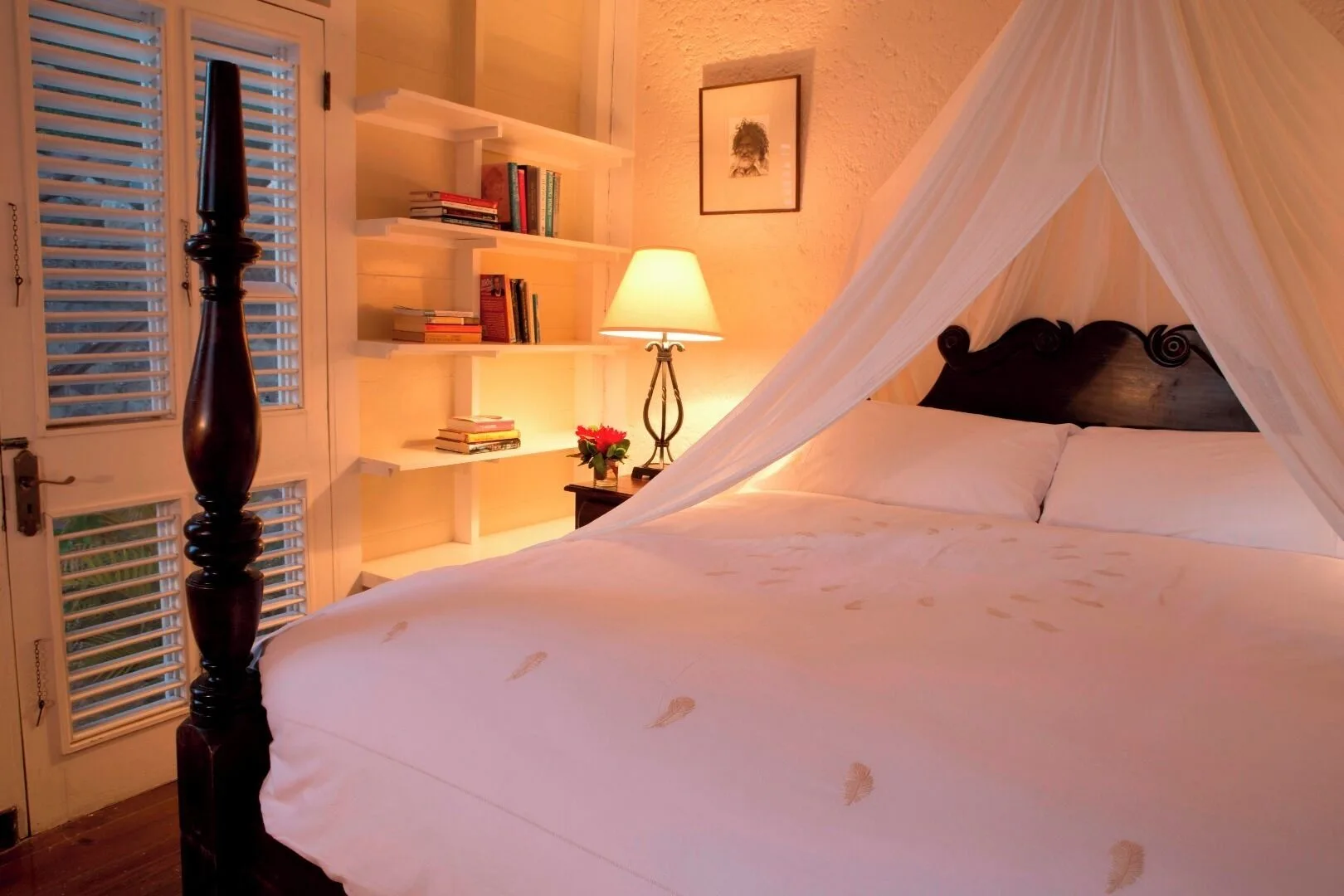 A four-poster bed with a white canopy in a Cottage 2 Bedrooms room at Strawberry Hill.