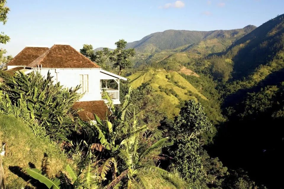Studio Suite exterior at Strawberry Hill set on a hillside with a balcony and mountain valley views.