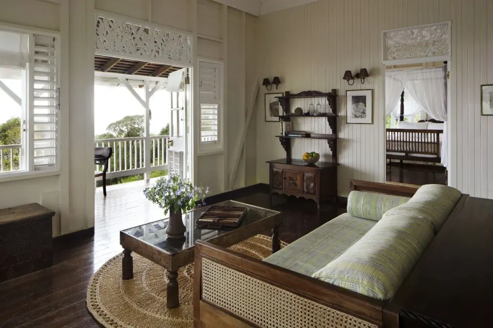 Villa 1 Bedroom sitting area with porch access and visible four-poster bed at Strawberry Hill.