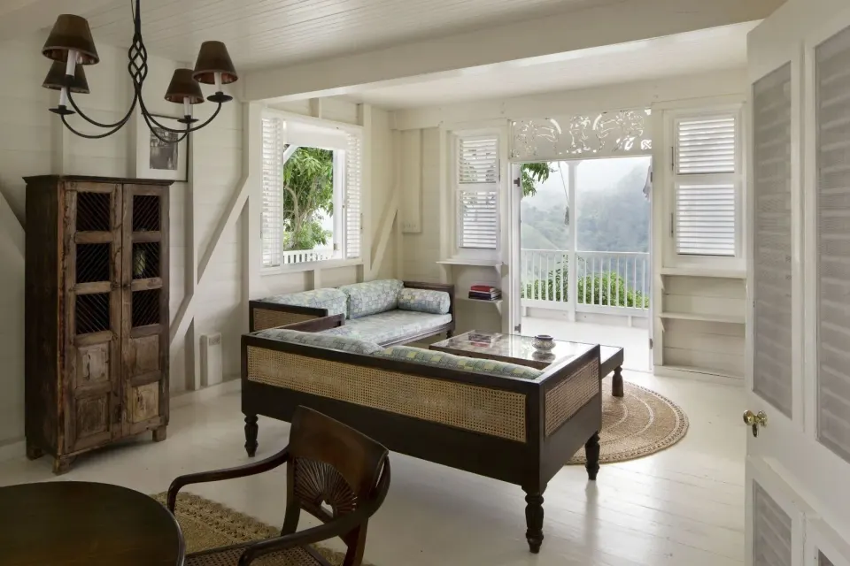Villa 1 Bedroom sitting room with balcony doors and mountain view at Strawberry Hill.
