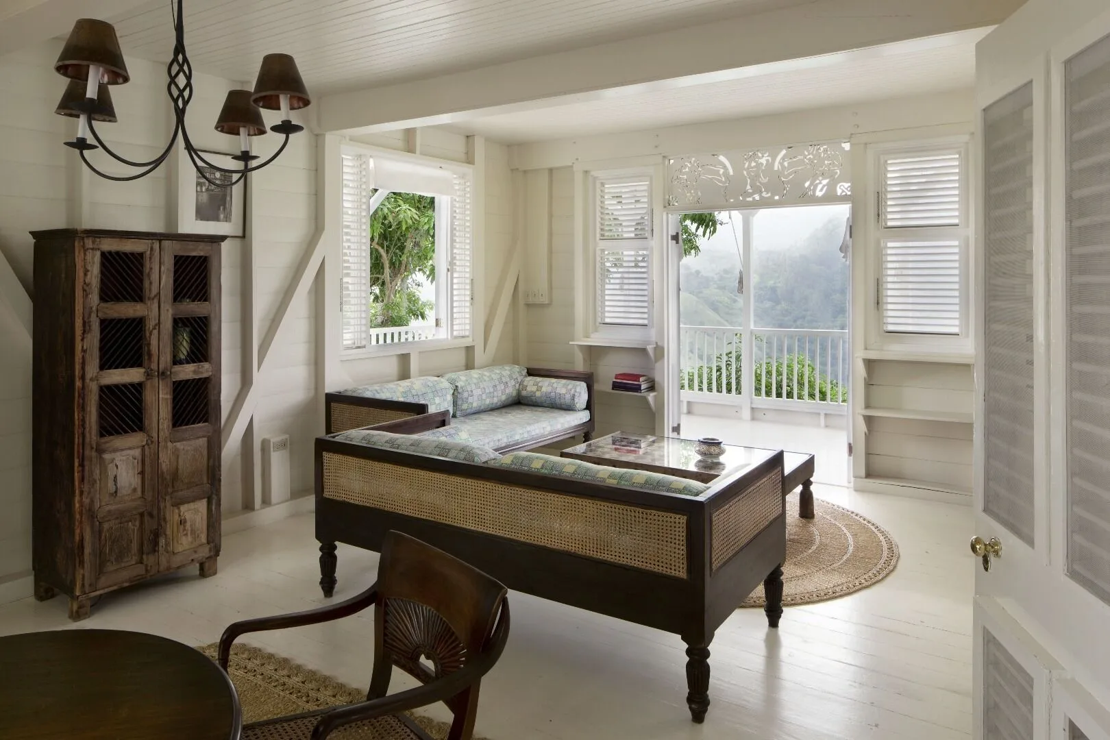 Villa 1 Bedroom sitting room with balcony doors and mountain view at Strawberry Hill.