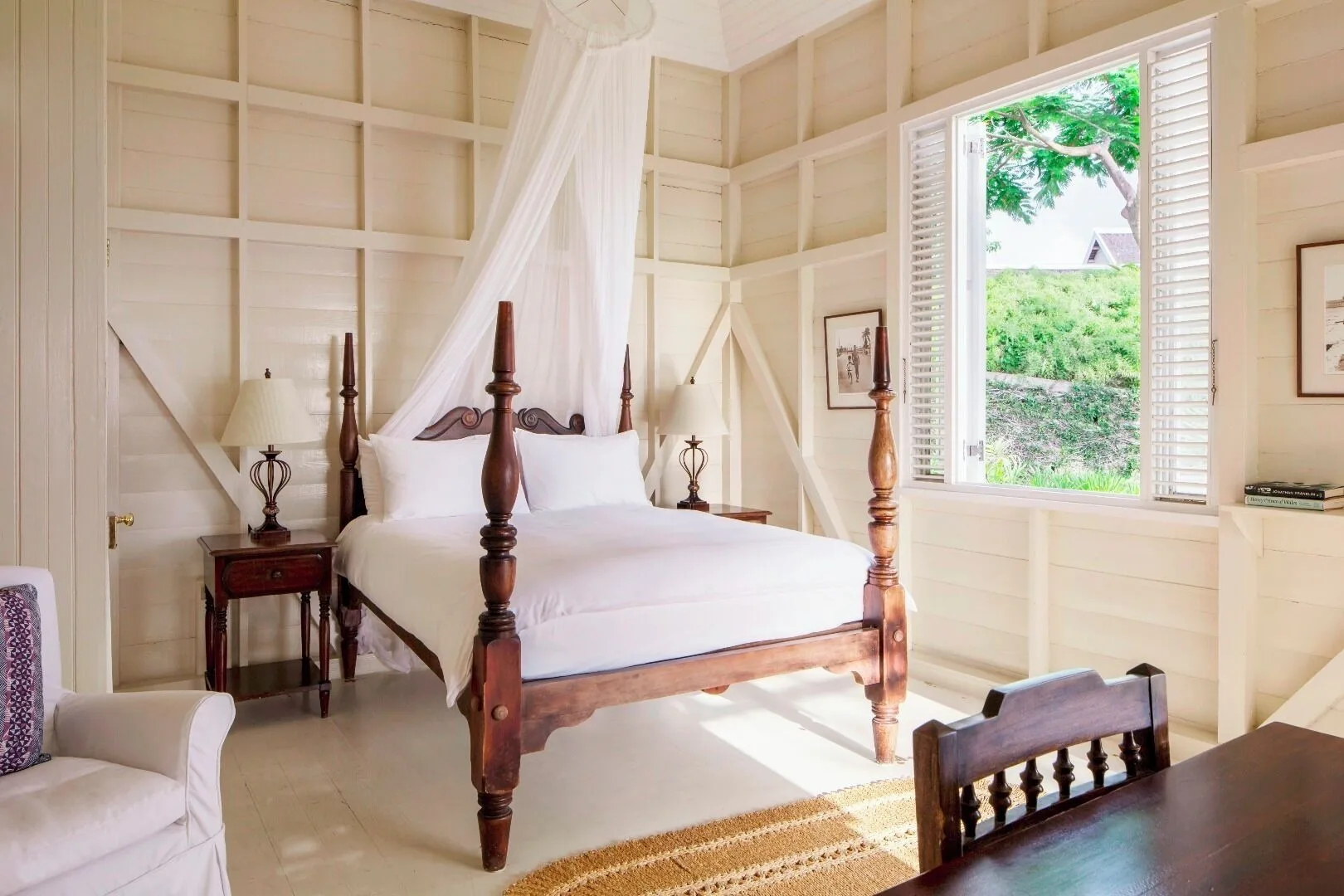 Villa 2 Bedrooms guest room with four-poster bed and open shutters at Strawberry Hill.