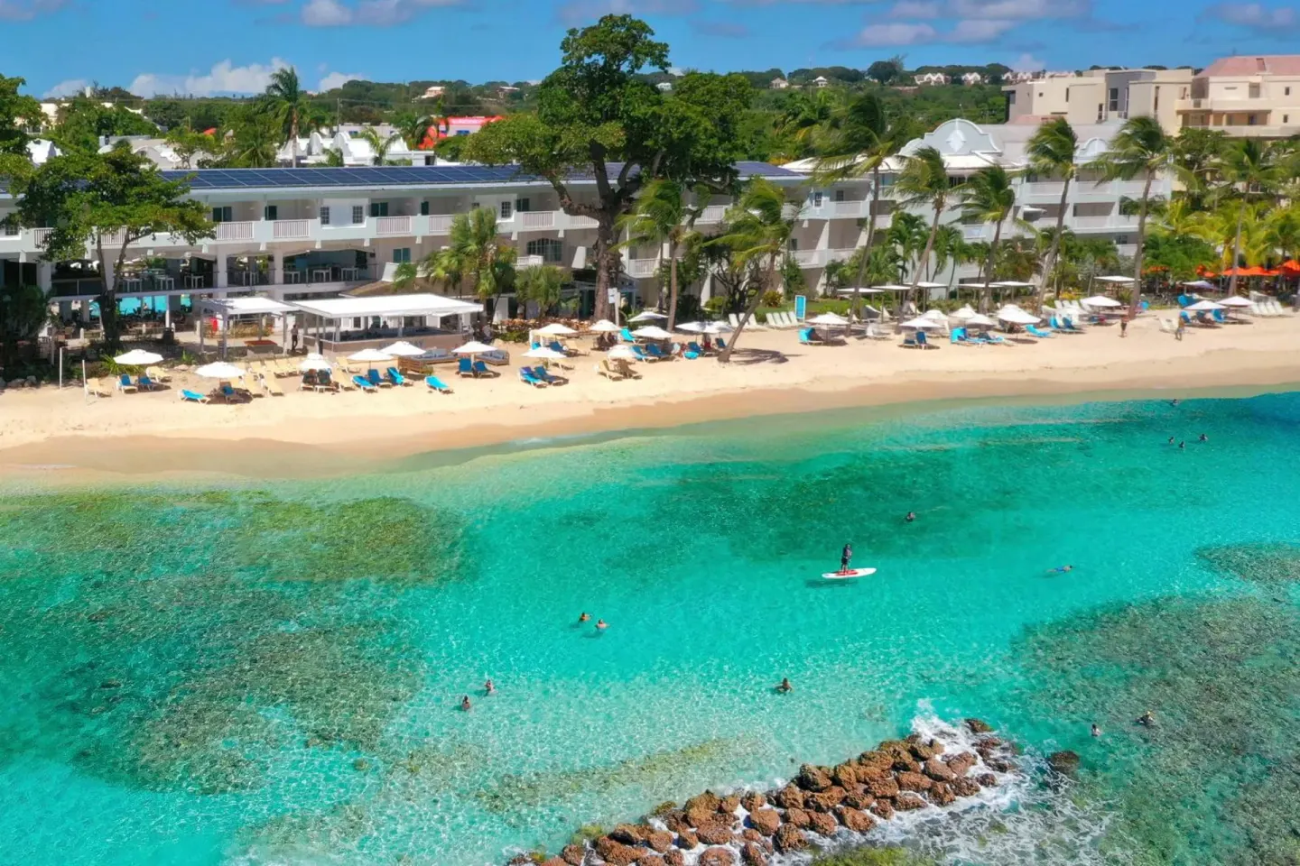 Aerial view of the resort beachfront and swimmers at Sugar Bay Barbados.