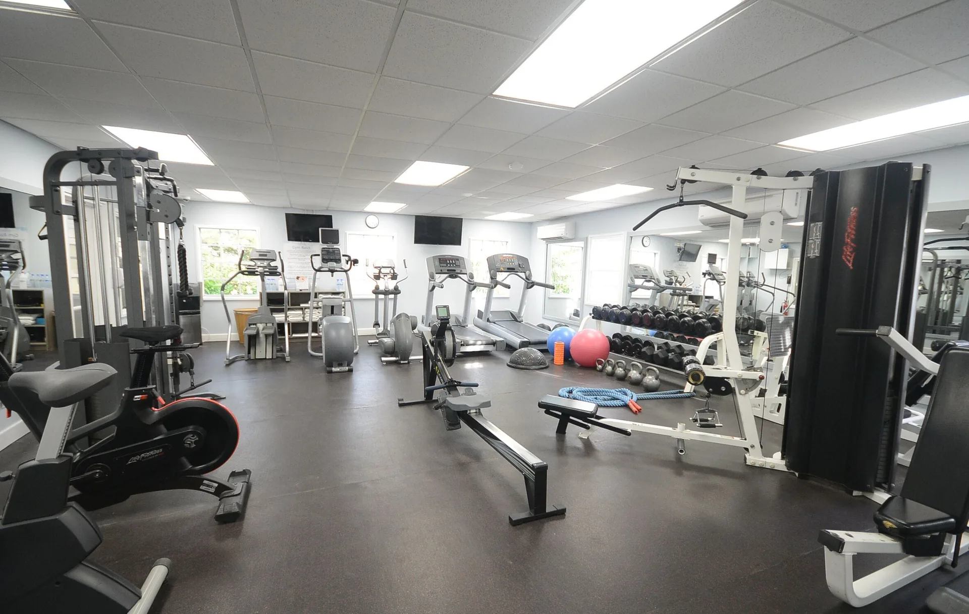 Fitness room with cardio machines, weights, and benches at Sugar Bay Barbados.