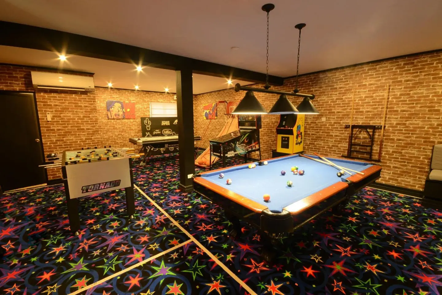 Games room with pool table, foosball and arcade games at Sugar Bay Barbados.