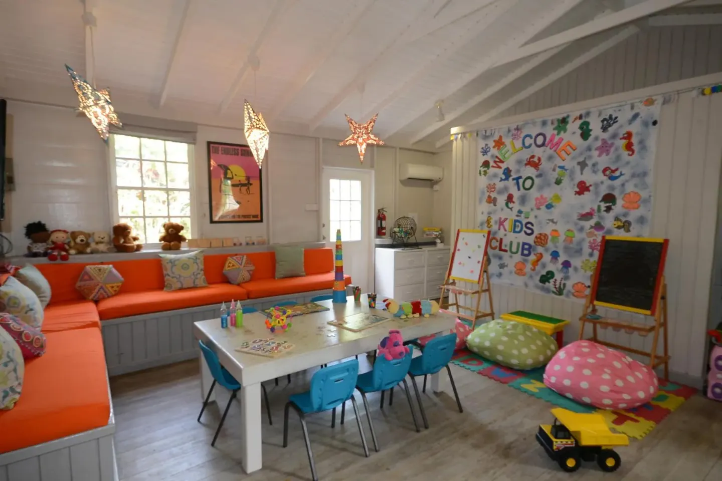 Kids club playroom with art tables, toys and bright seating at Sugar Bay Barbados.