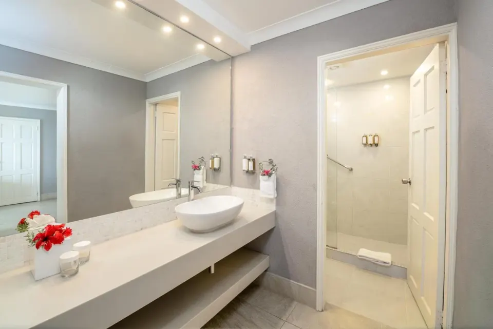 Deluxe Oceanfront Room bathroom vanity and shower at Sugar Bay Barbados.