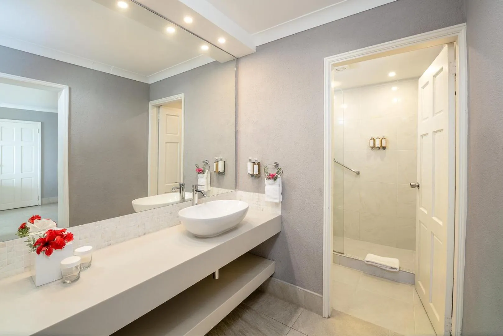 Deluxe Oceanfront Room bathroom vanity and shower at Sugar Bay Barbados.
