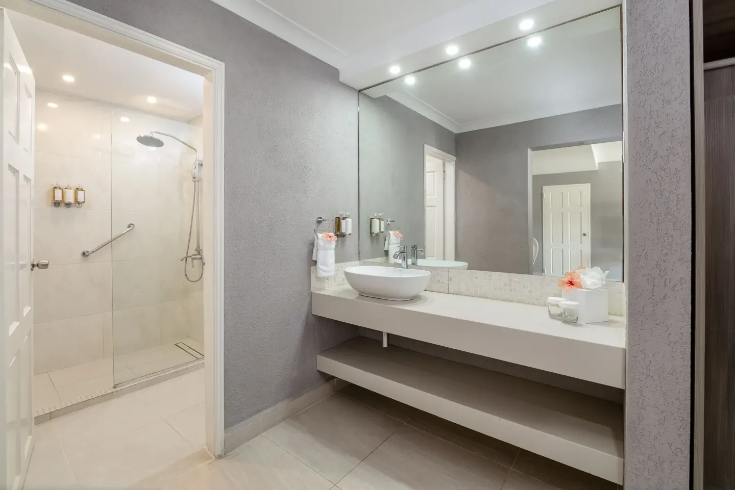 Family Suite Garden View bathroom with vanity and walk-in shower at Sugar Bay Barbados.