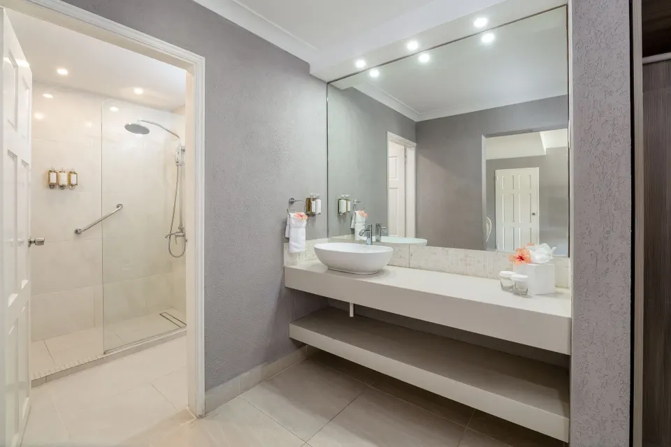 Family Suite Garden View bathroom with vanity and walk-in shower at Sugar Bay Barbados.