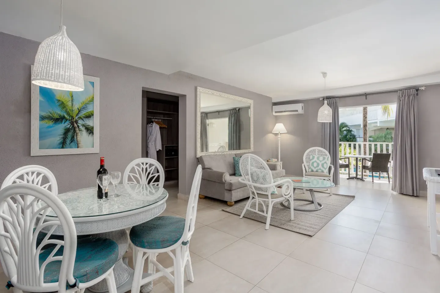 Family Suite Garden View living and dining area with balcony at Sugar Bay Barbados.