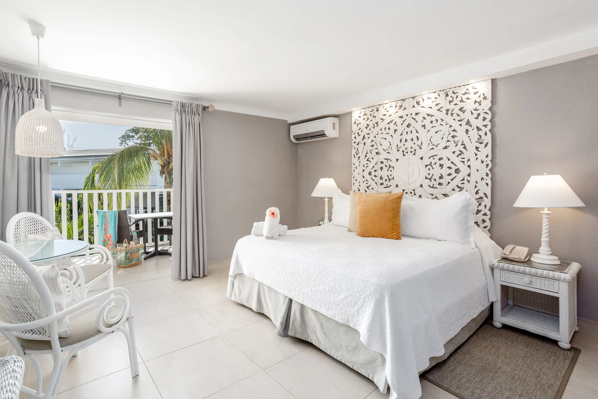 Signature Room Garden View bedroom with king bed and balcony at Sugar Bay Barbados.