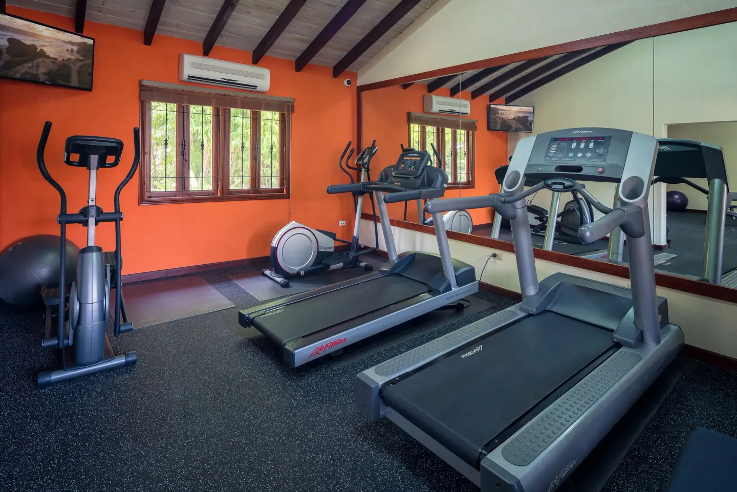 Cardio machines in the fitness room at Sugar Cane Club Hotel And Spa.