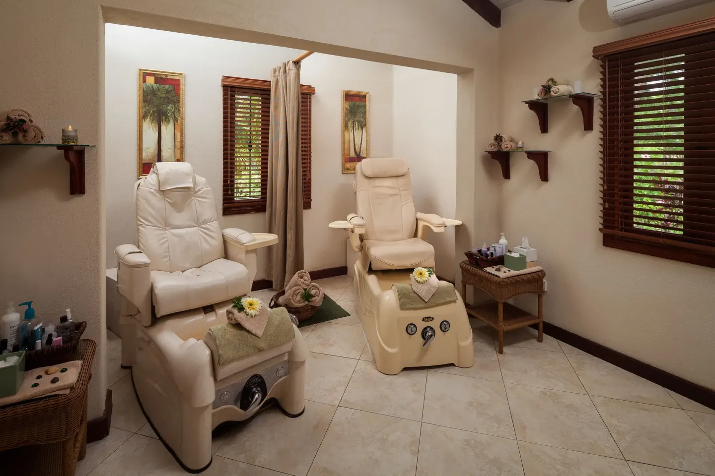 Pedicure chairs in a spa treatment room at Sugar Cane Club Hotel And Spa.