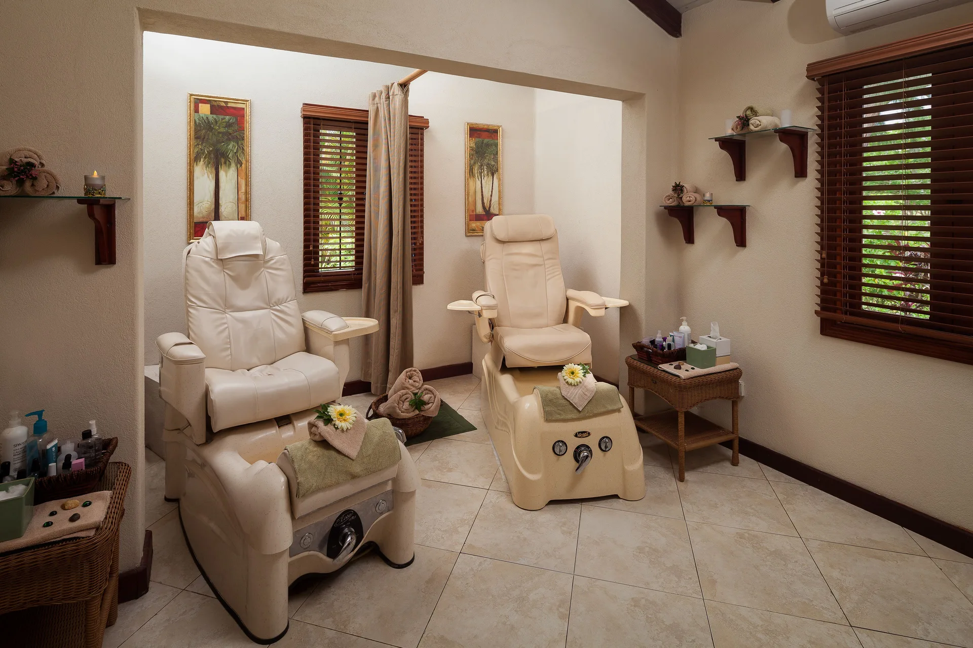 Pedicure chairs in a spa treatment room at Sugar Cane Club Hotel And Spa.