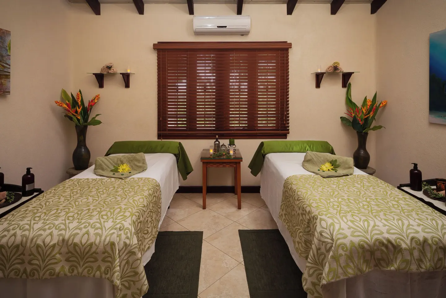 Twin massage beds in a spa room at Sugar Cane Club Hotel And Spa.