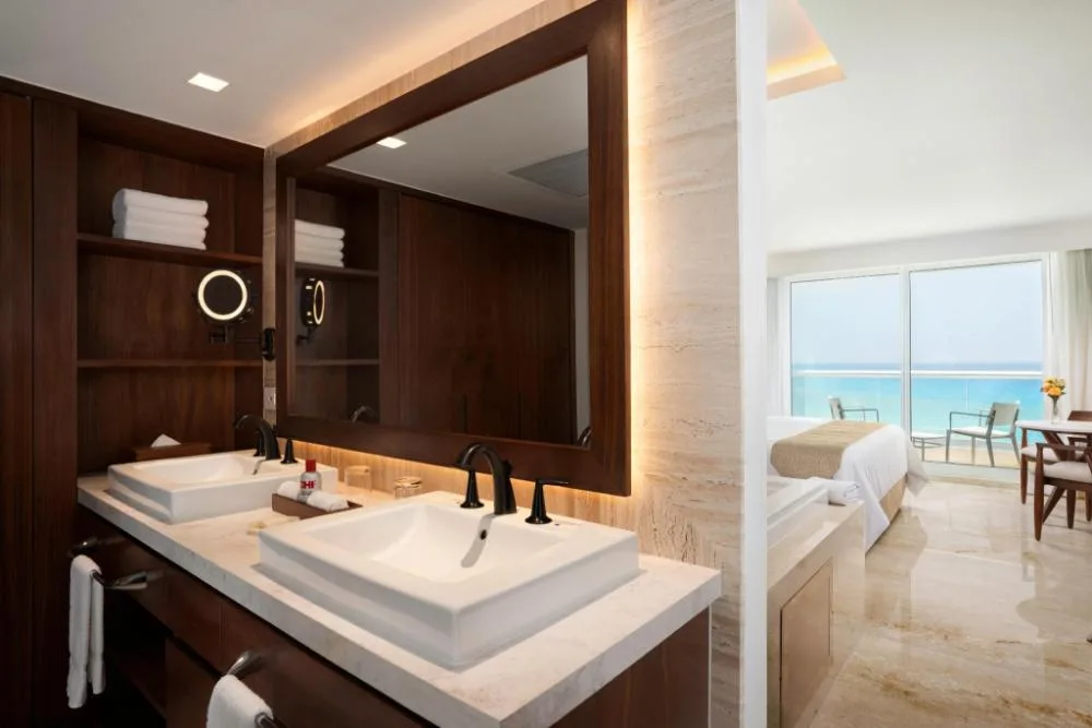 Superior Deluxe Ocean View vanity and king bed room at Sun Palace Cancun.