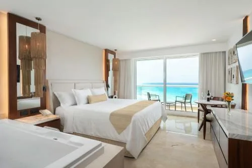 Superior Deluxe Ocean View king bed room with in-room tub at Sun Palace Cancun.