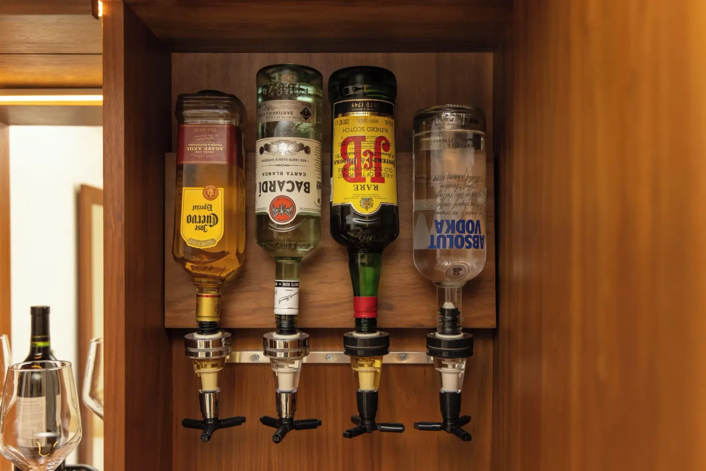 In-room liquor dispenser cabinet in a Superior Deluxe Ocean View room at Sun Palace Cancun.