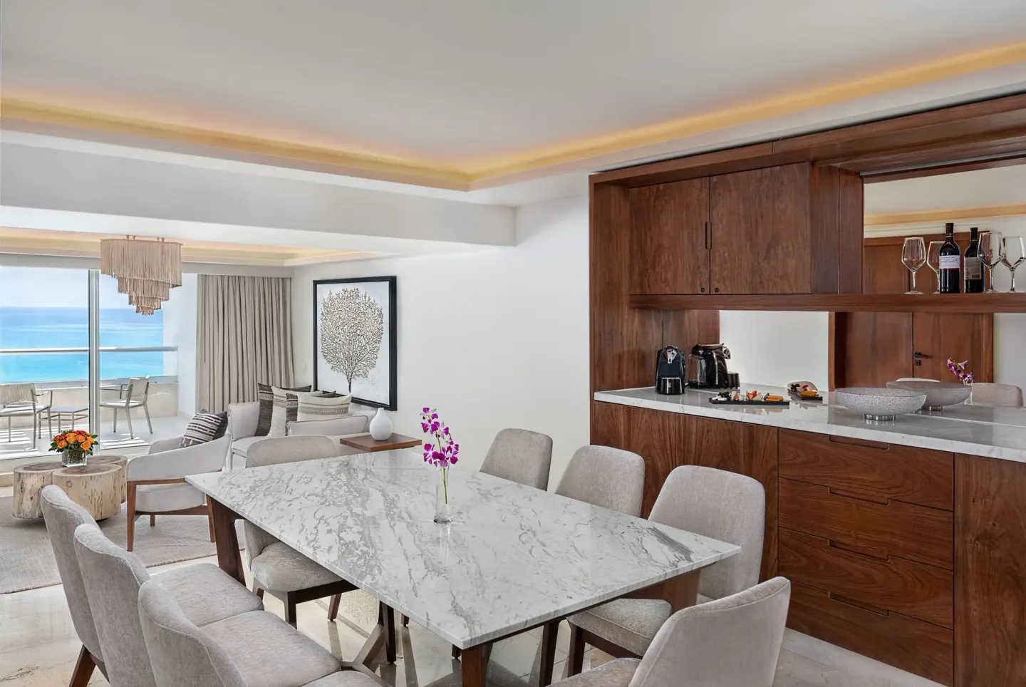 Superior Governor Suite dining area and lounge with ocean-view balcony at Sun Palace Cancun.