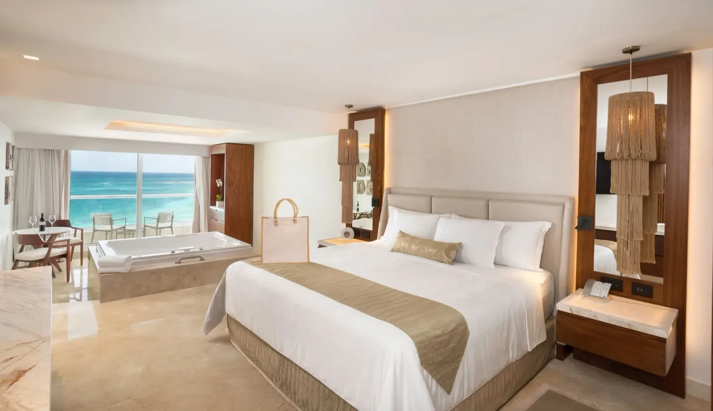 Superior Honeymoon Suite Ocean View king bed and tub at Sun Palace Cancun.