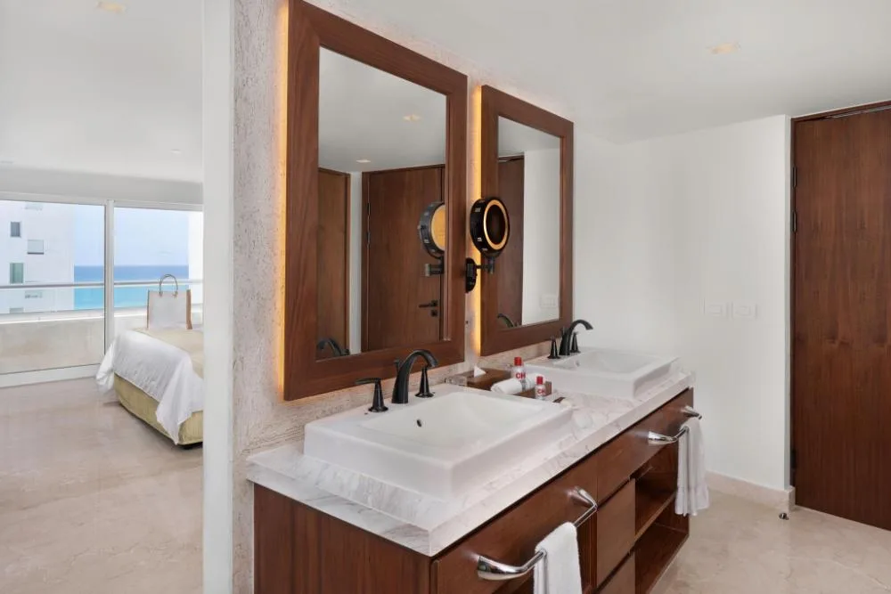 Double-sink bathroom in the Superior Two Bedroom Presidential Suite at Sun Palace Cancun.