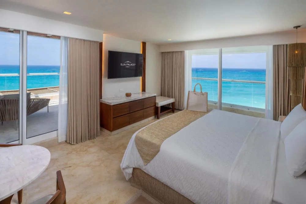 Ocean-view king bedroom in the Superior Two Bedroom Presidential Suite at Sun Palace Cancun.