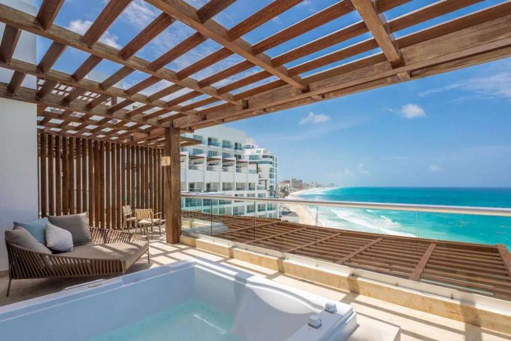 Ocean-view terrace with hot tub for the Superior Two Bedroom Presidential Suite at Sun Palace Cancun.