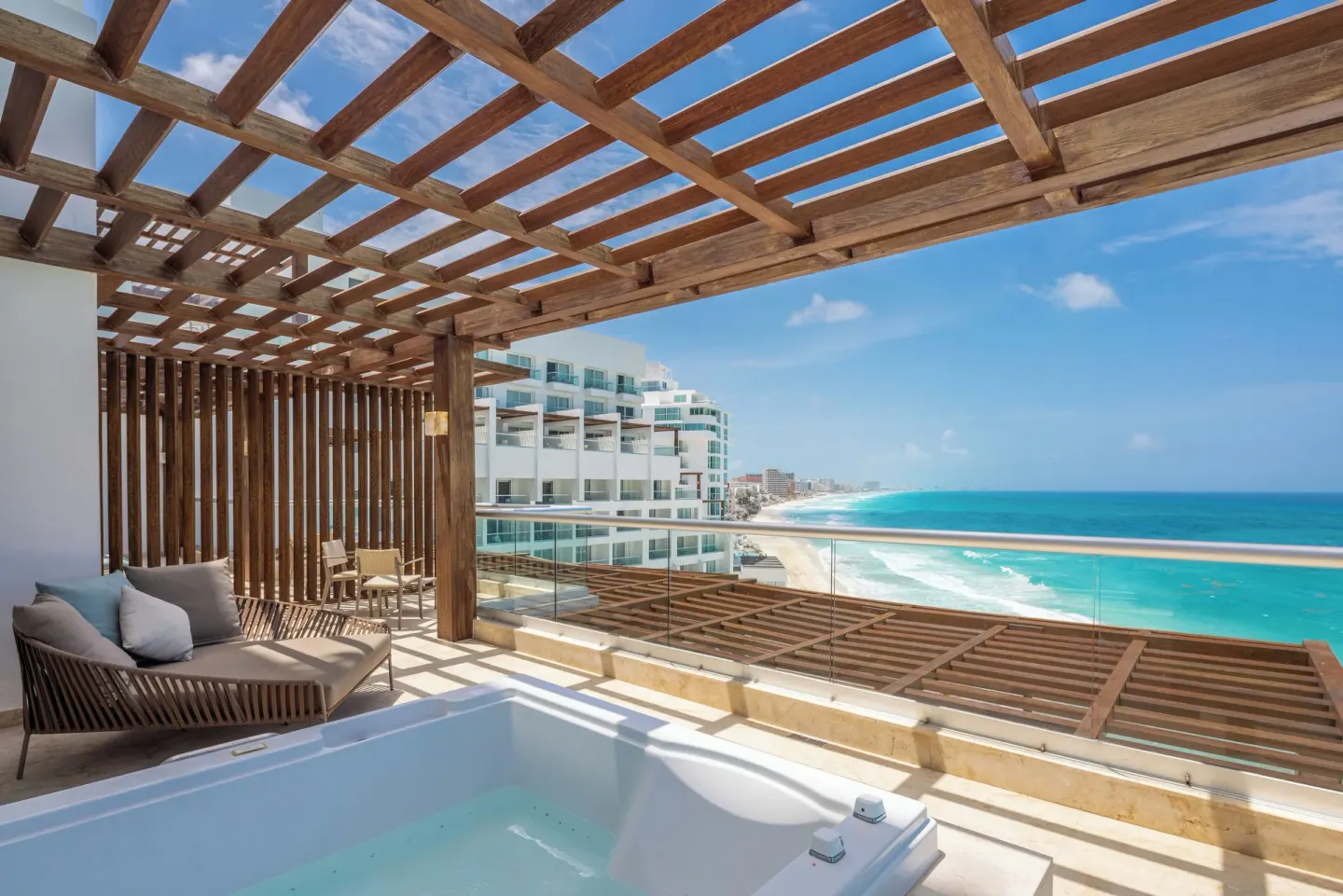 Private terrace with plunge tub and ocean view at Sun Palace Cancun.