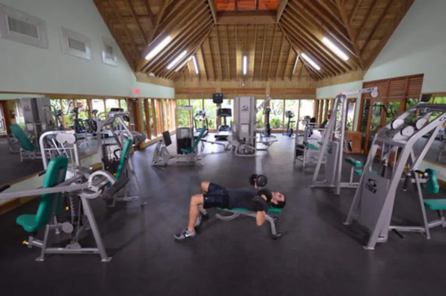 Spacious fitness center with weight machines at Sunset at the Palms Resort.