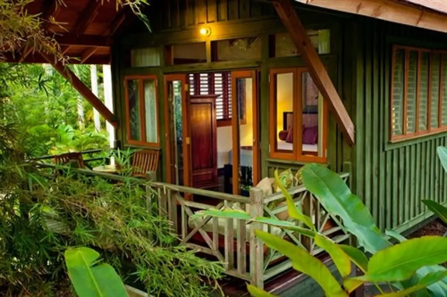 Exterior of a Treetop 1-Bedroom Suite at Sunset at the Palms Resort surrounded by tropical plants.