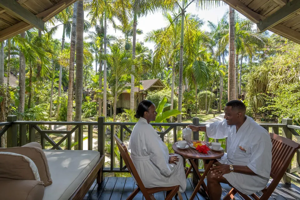Treetop Deluxe balcony breakfast setting at Sunset at the Palms Resort.