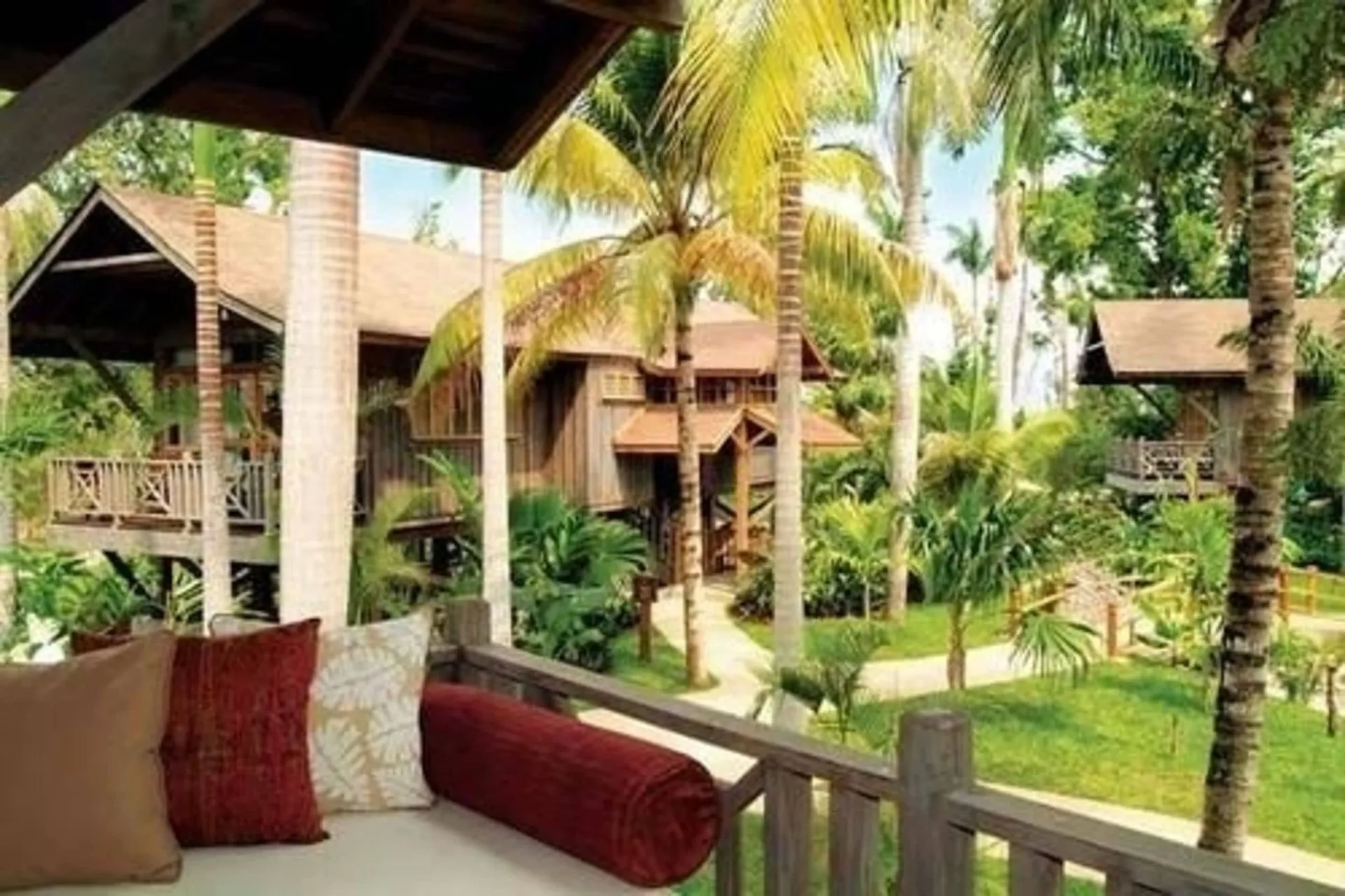 Treetop Deluxe balcony view of garden cottages at Sunset at the Palms Resort.
