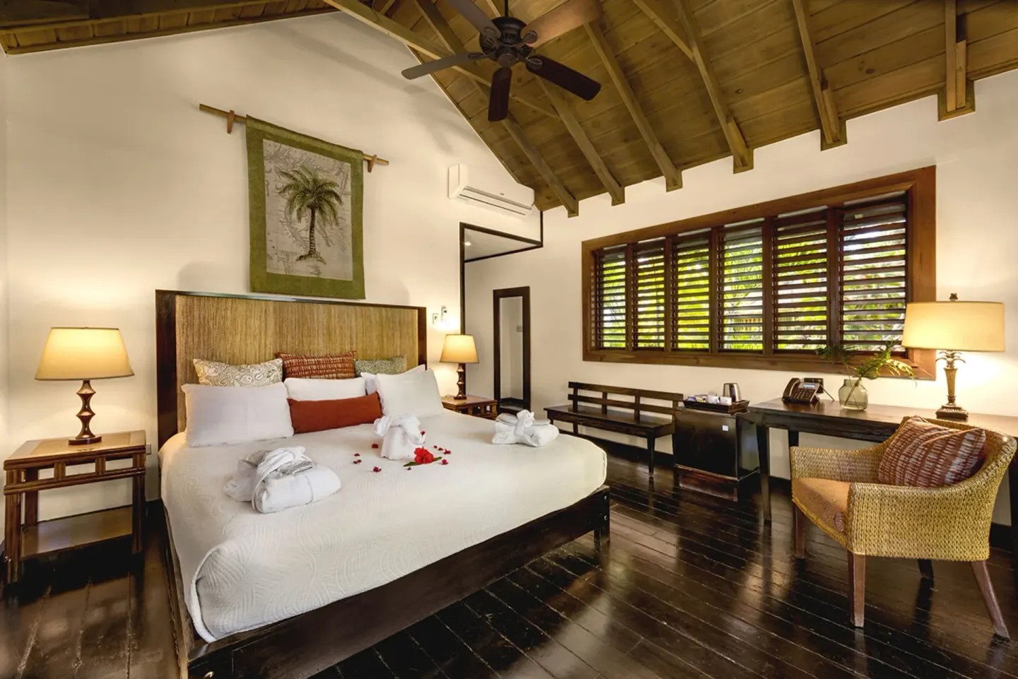 Treetop Deluxe king bed with vaulted ceiling at Sunset at the Palms Resort.