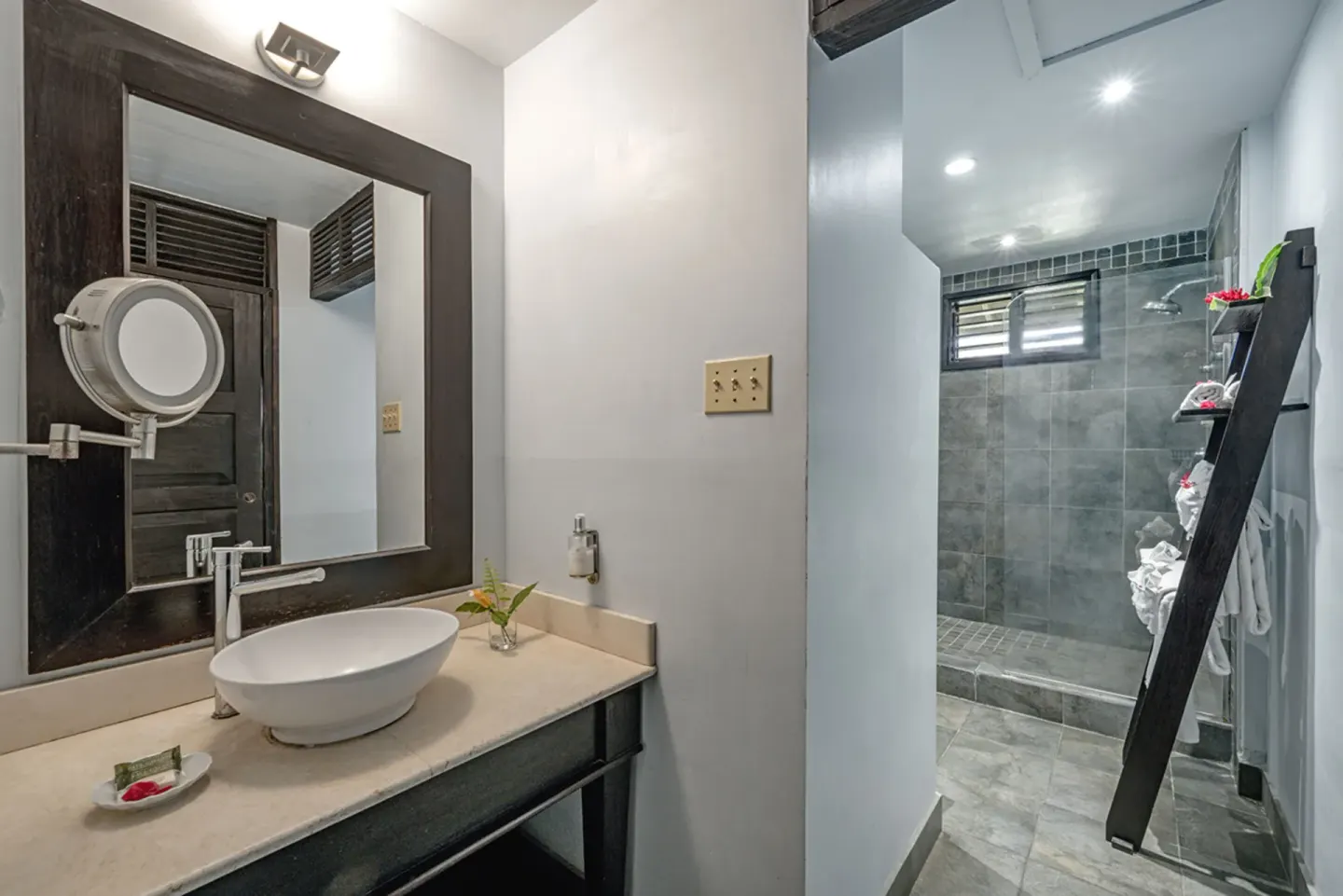 Treetop Standard bathroom with vessel sink and walk-in shower at Sunset at the Palms Resort.