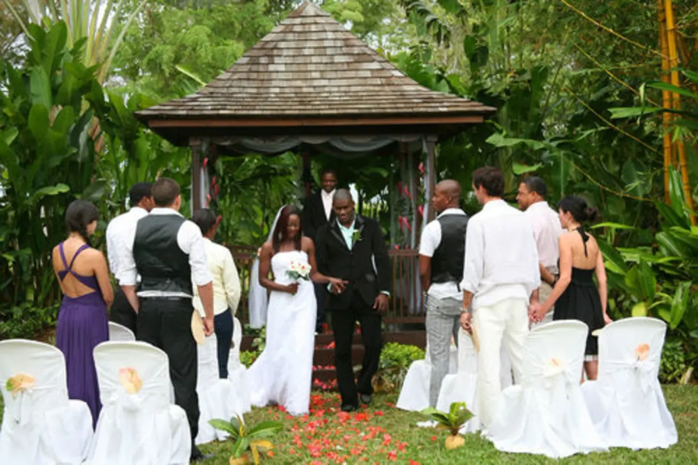 Garden wedding ceremony under a gazebo at Sunset at the Palms Resort.