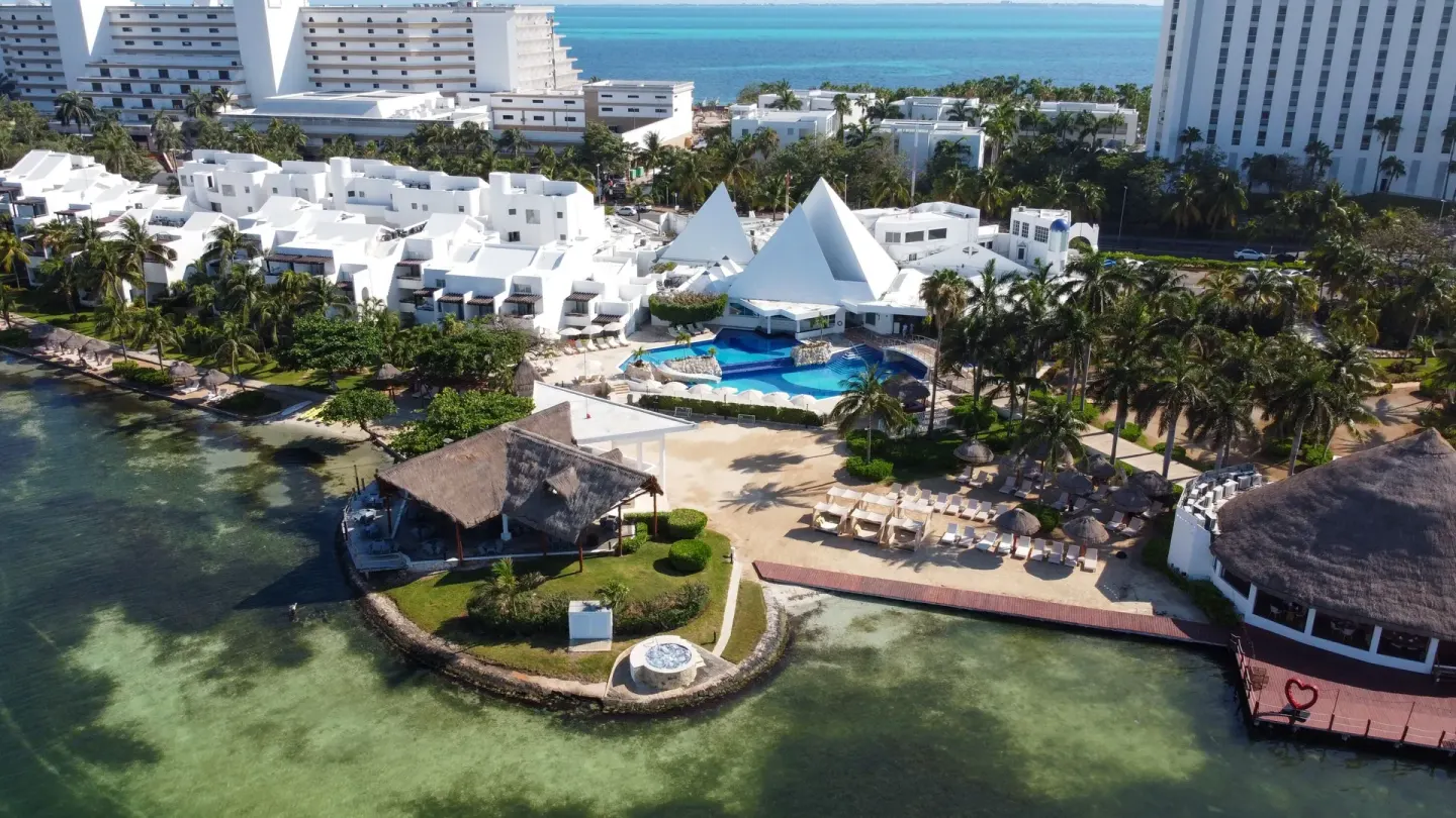 Aerial view of pool, loungers and lagoon docks at Sunset Marina Resort & Yacht Club.