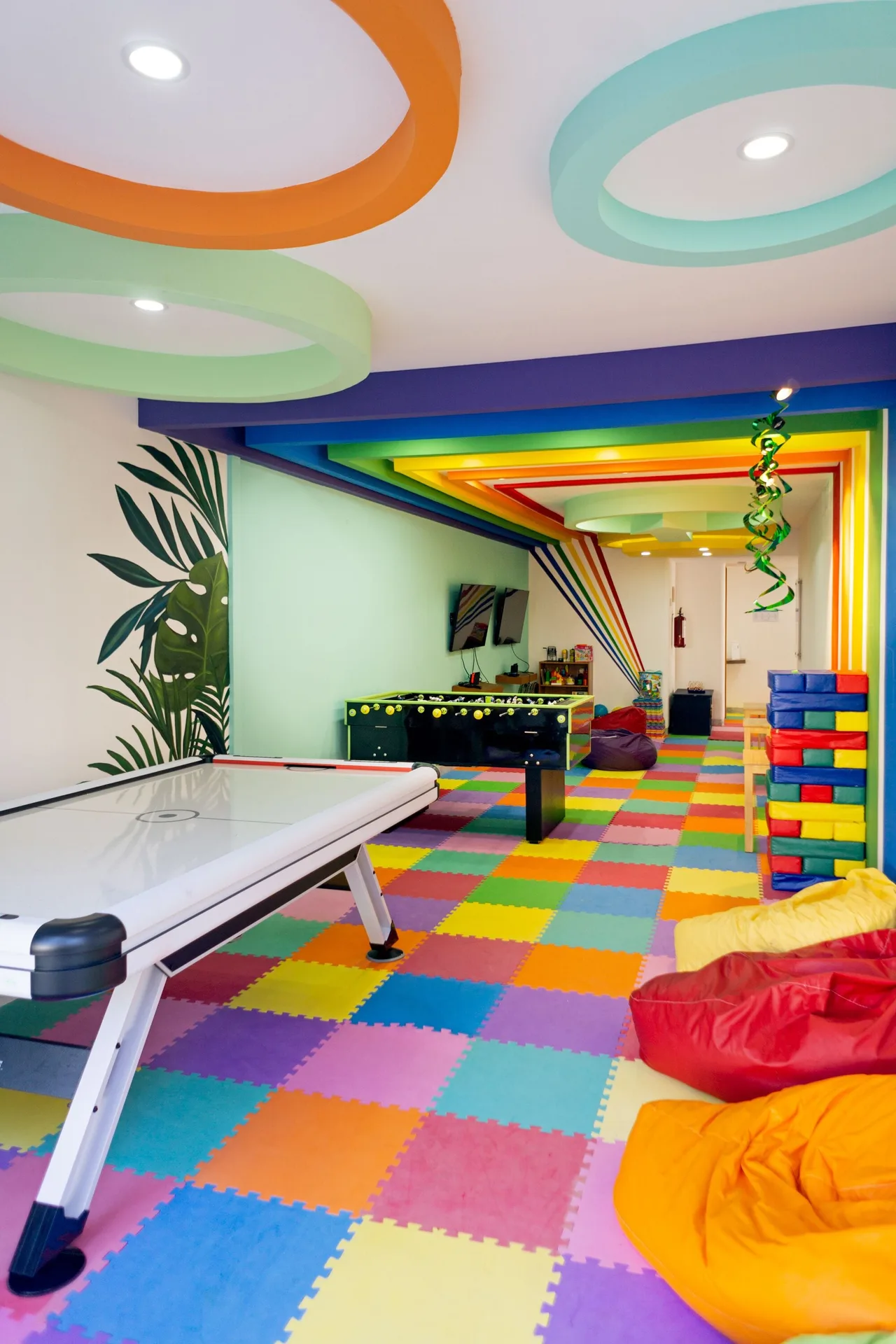 Colorful game room with air hockey and beanbags at Sunset Marina Resort & Yacht Club.