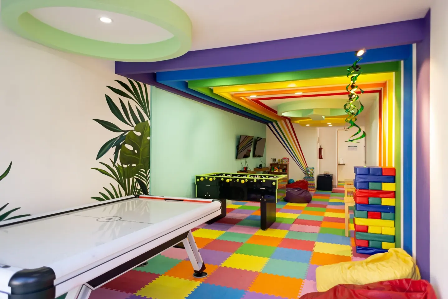 Colorful game room with air hockey, foosball, and block play at Sunset Marina Resort & Yacht Club.