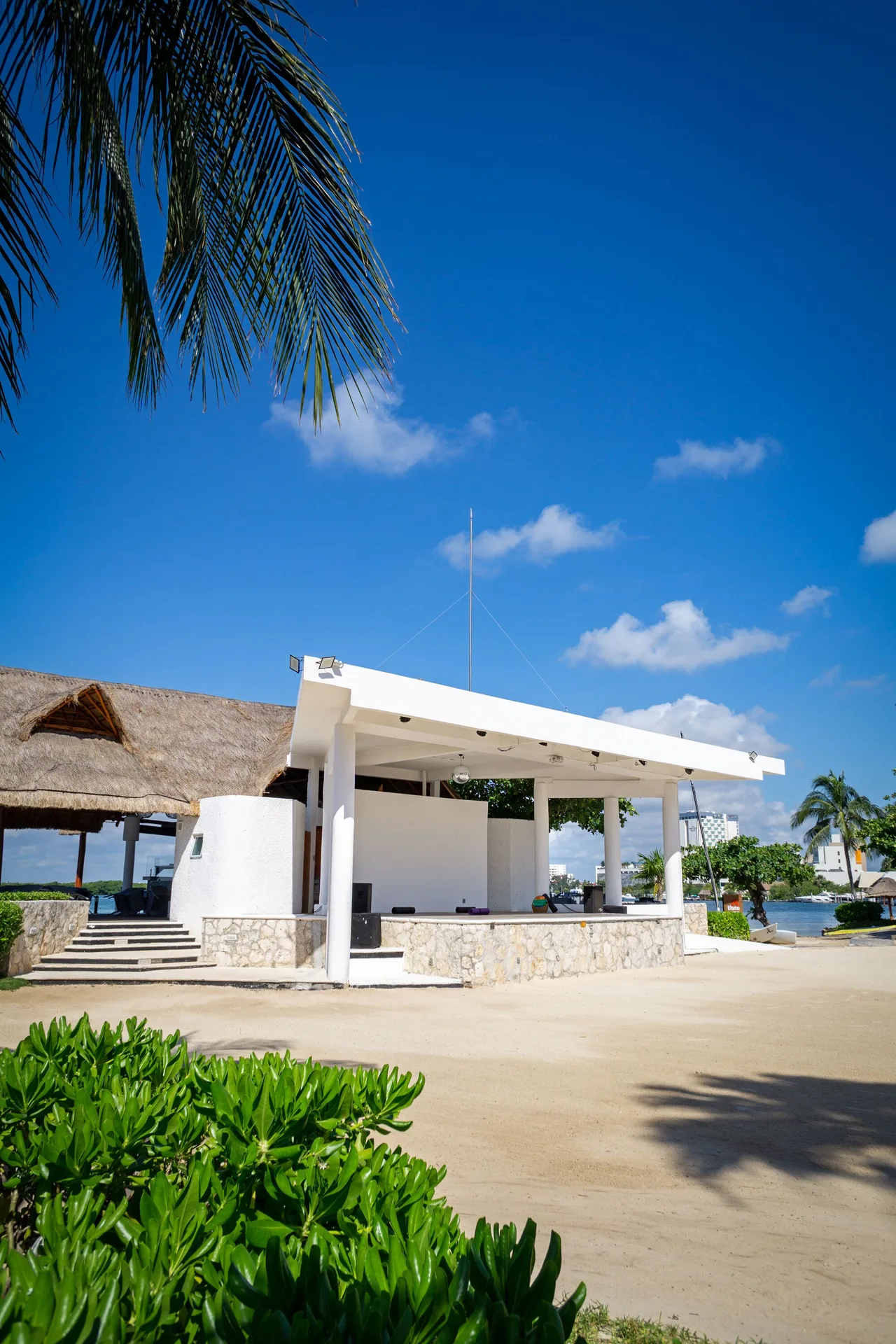 Open-air white pavilion by the water at Sunset Marina Resort & Yacht Club.