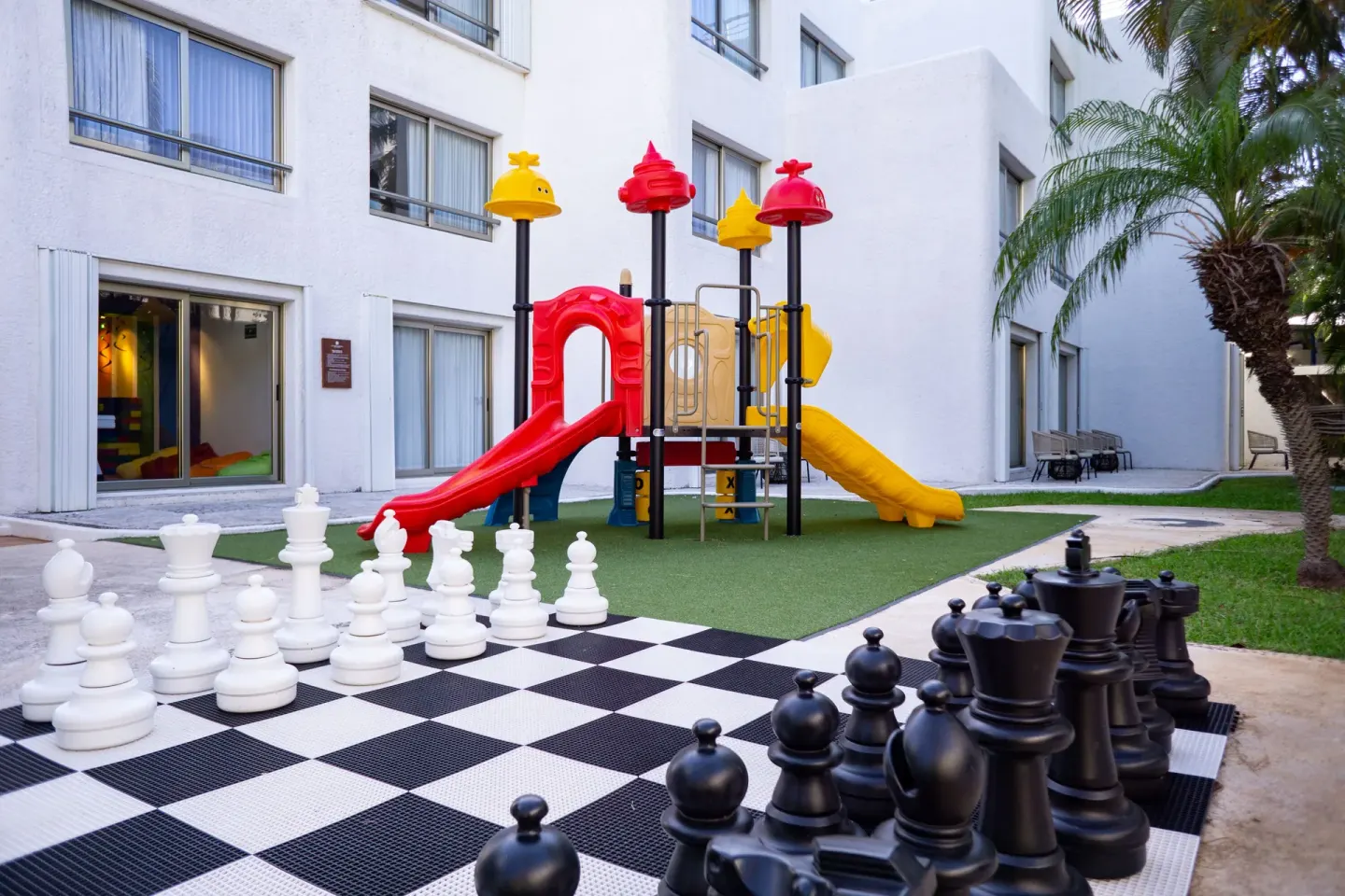 Outdoor chess set and colorful playground at Sunset Marina Resort & Yacht Club.