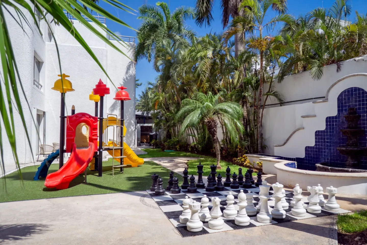 Playground, giant chess set and fountain at Sunset Marina Resort & Yacht Club.