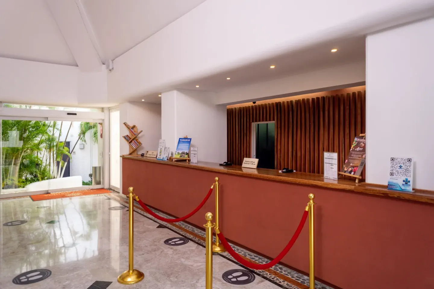 Reception counter with queue ropes at Sunset Marina Resort & Yacht Club.
