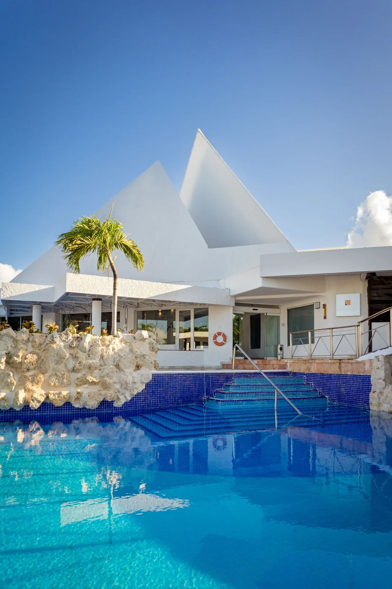 Swimming pool steps and white rooflines at Sunset Marina Resort & Yacht Club.