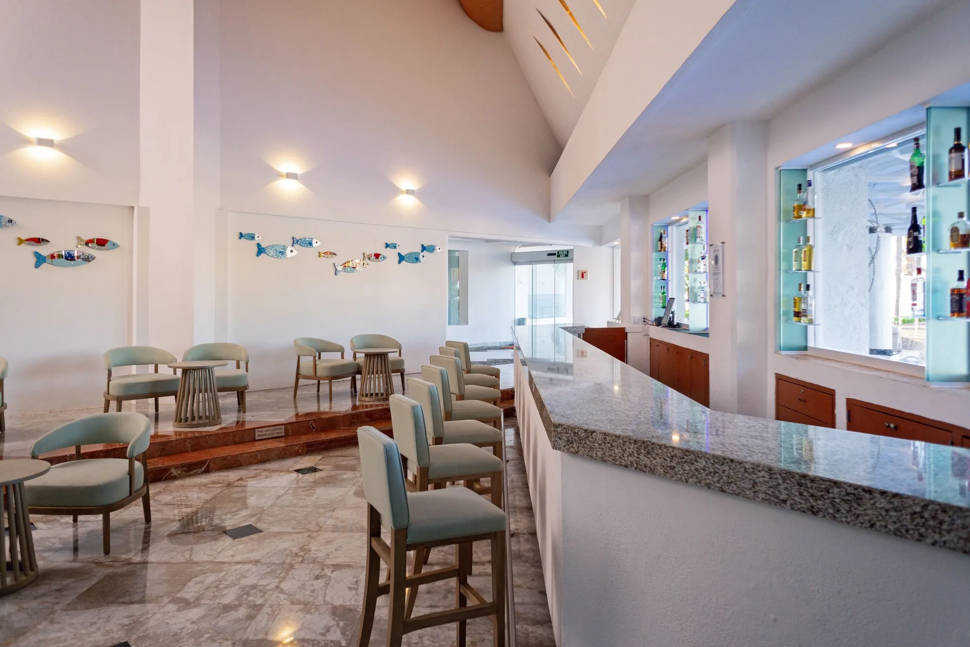 Lobby Bar seating and marble counter at Sunset Marina Resort & Yacht Club.