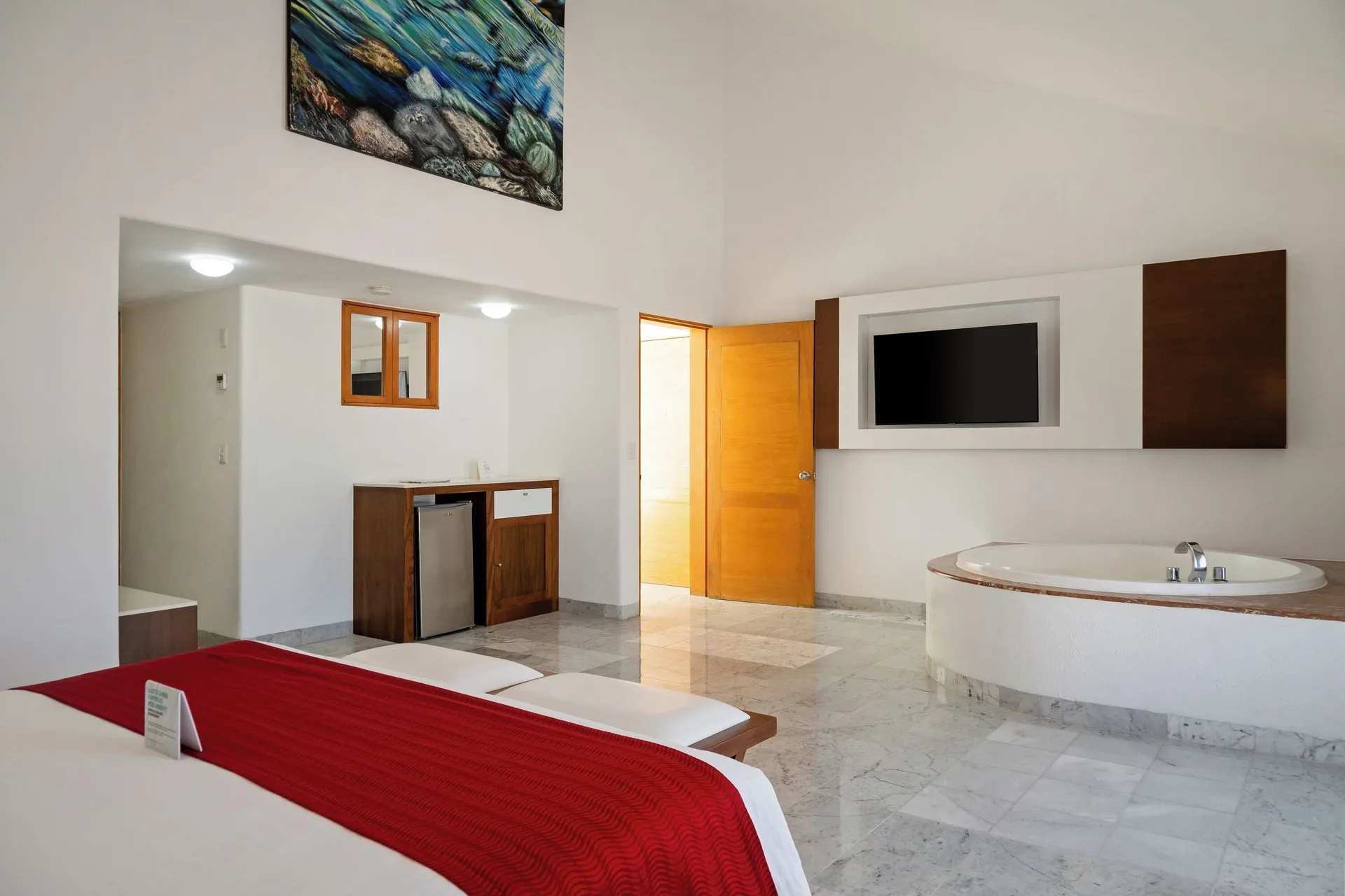 Suite bedroom with whirlpool tub at Sunset Marina Resort & Yacht Club.
