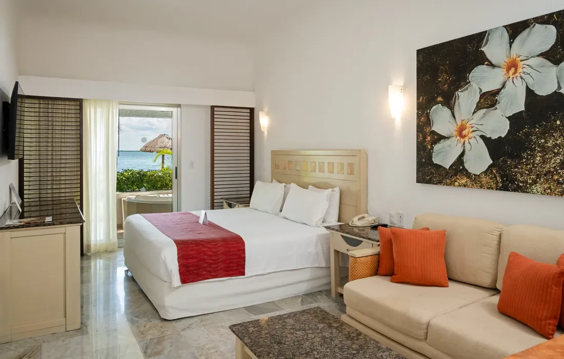 Standard Garden View room with king bed and sofa at Sunset Marina Resort & Yacht Club.